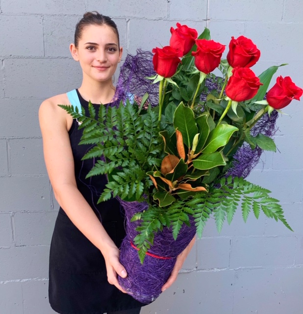 Half dozen red roses hand delivered by florist Miami Queensland